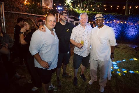 Four campers posing together at the closing party of Summer Camp 2026
