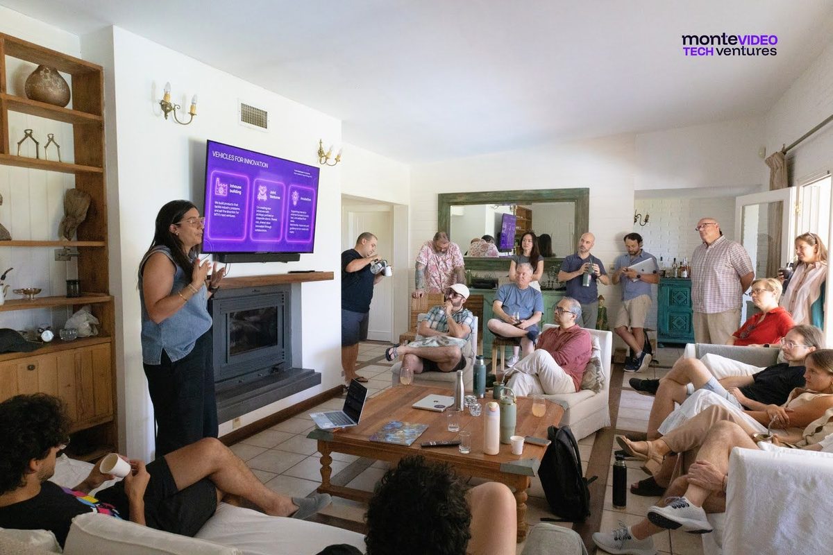 A session of the 2026 Innovation Track: a presentation on a screen and the group seated around it