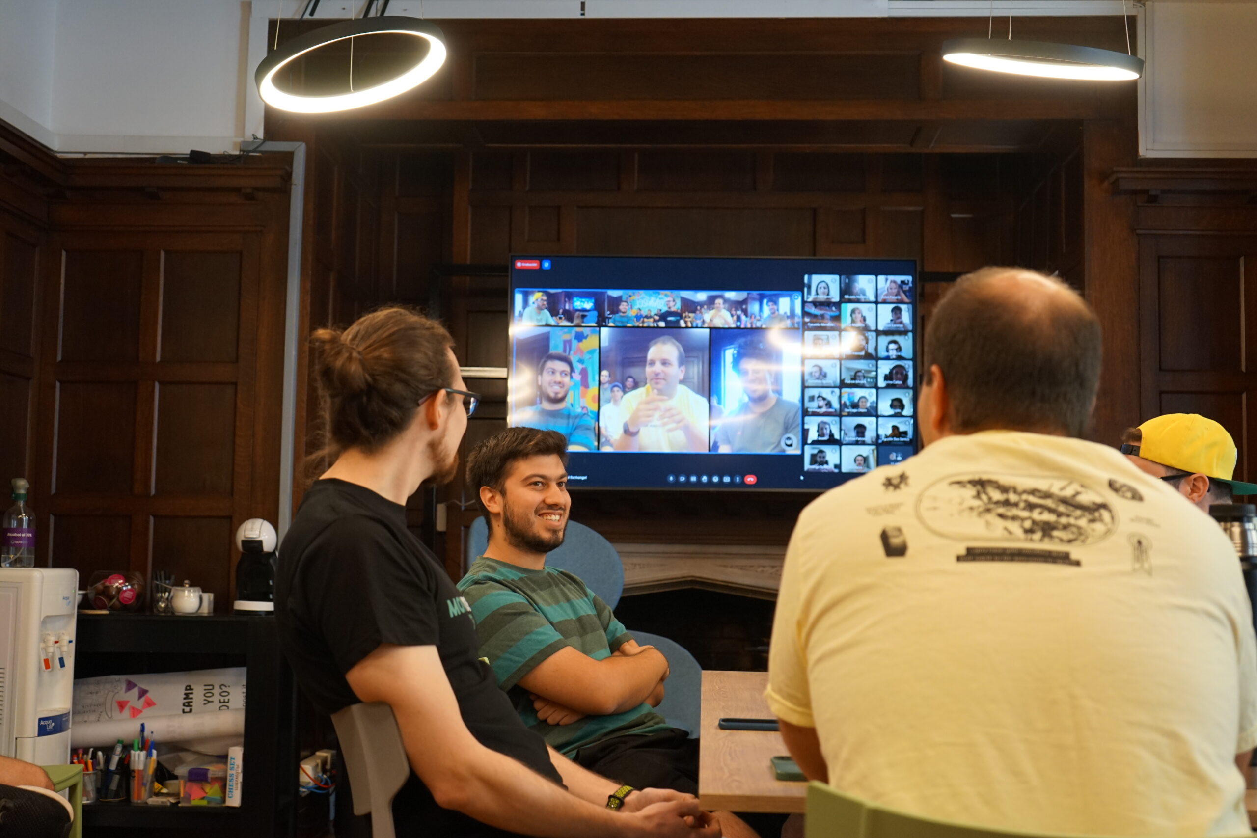 Participants following a session on a large screen during Summer Camp 2023