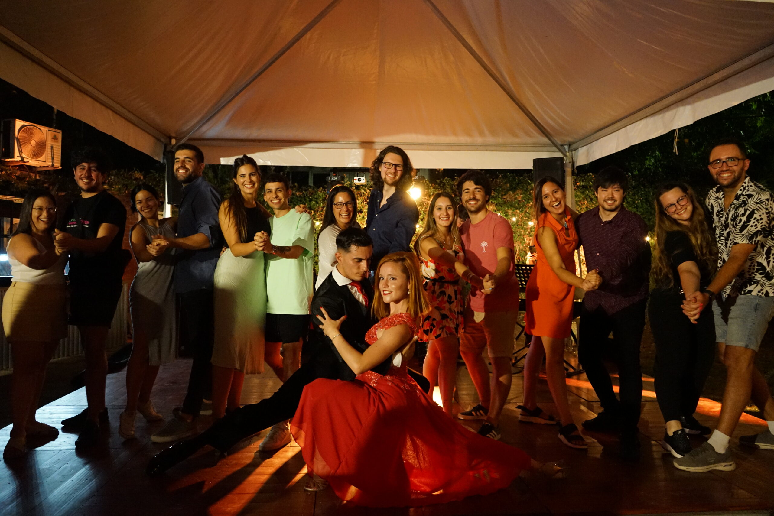 Group photo of the community at an evening event